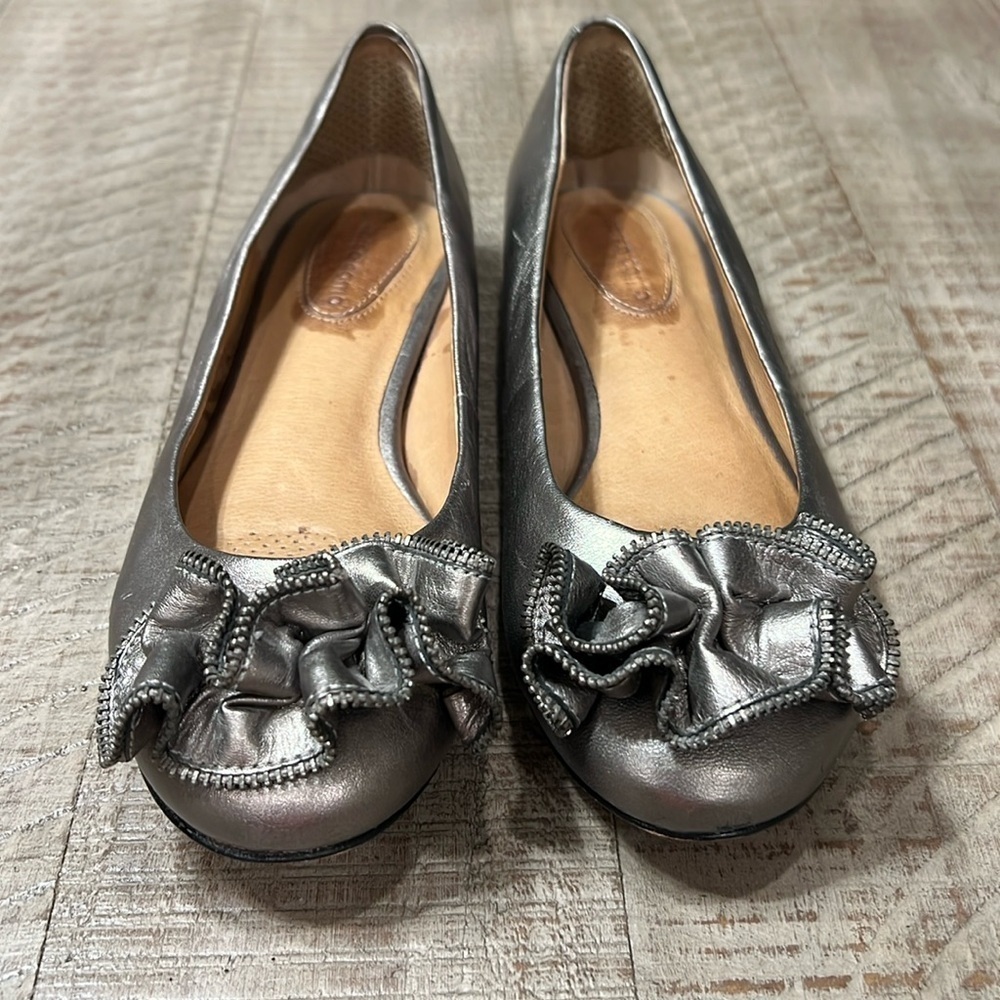 Corso Como pewter ballerina flats with funky flower adornment on the toes.